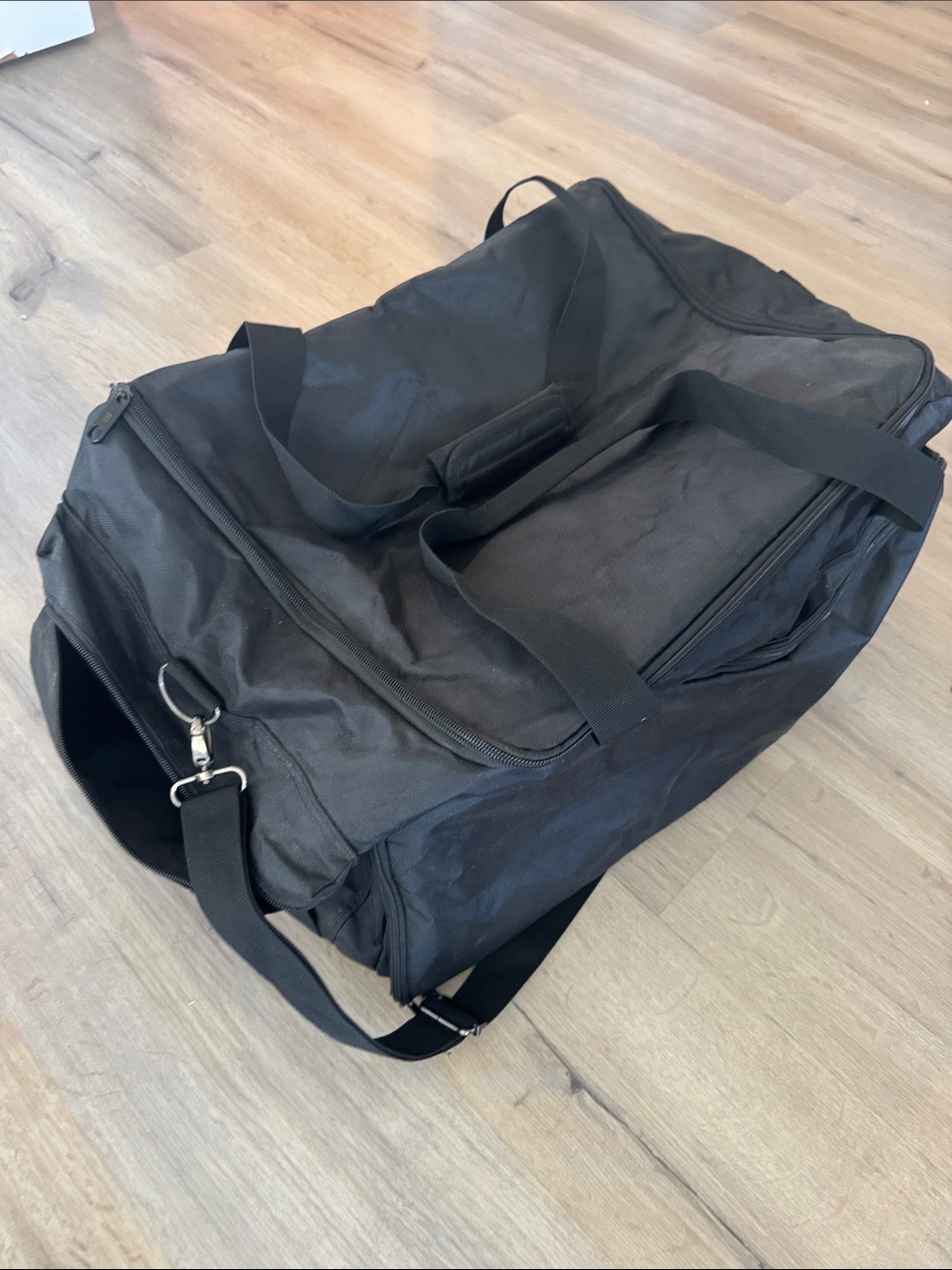 Black durable Duffle Bag with several pockets.